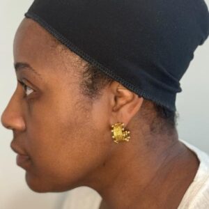 Side view of black bamboo wig cap liner on head of a black woman.