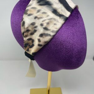 Animal print fabric on a mannequin head.