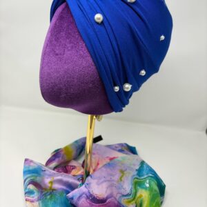 Royal blue fabric on top of a mannequin head.